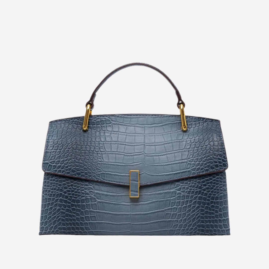 A stylish blue handbag with a crocodile skin texture and gold hardware.