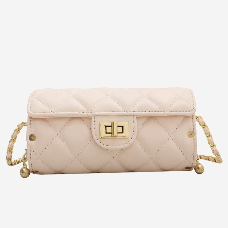 A tan quilted handbag with a gold-colored lock closure and chain strap.