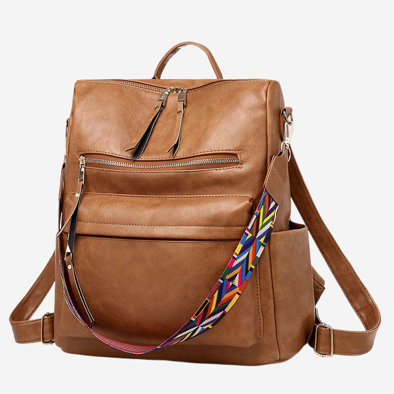 A brown leather backpack with multiple pockets and zippers.