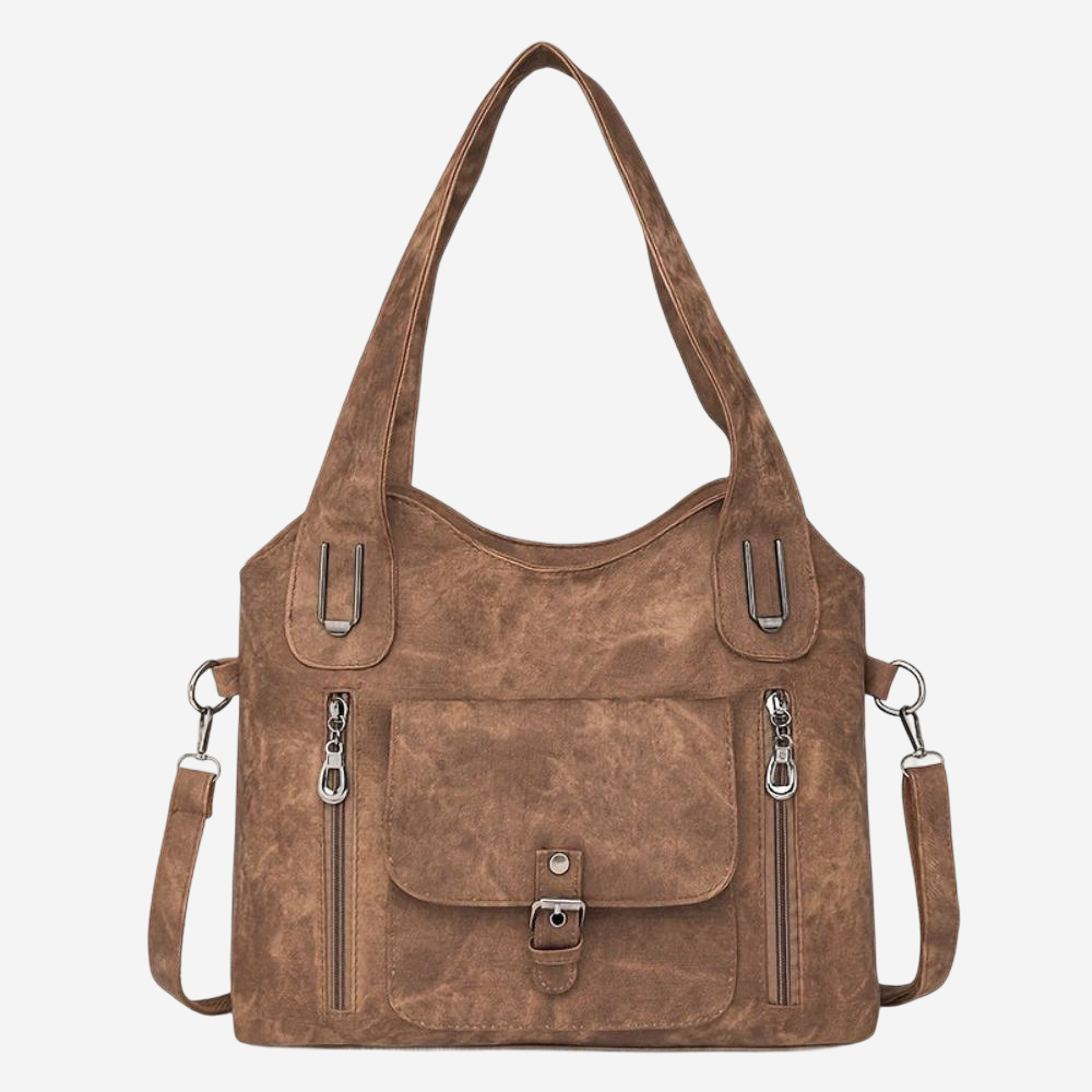 A brown leather shoulder bag with multiple zippers and a front pocket.