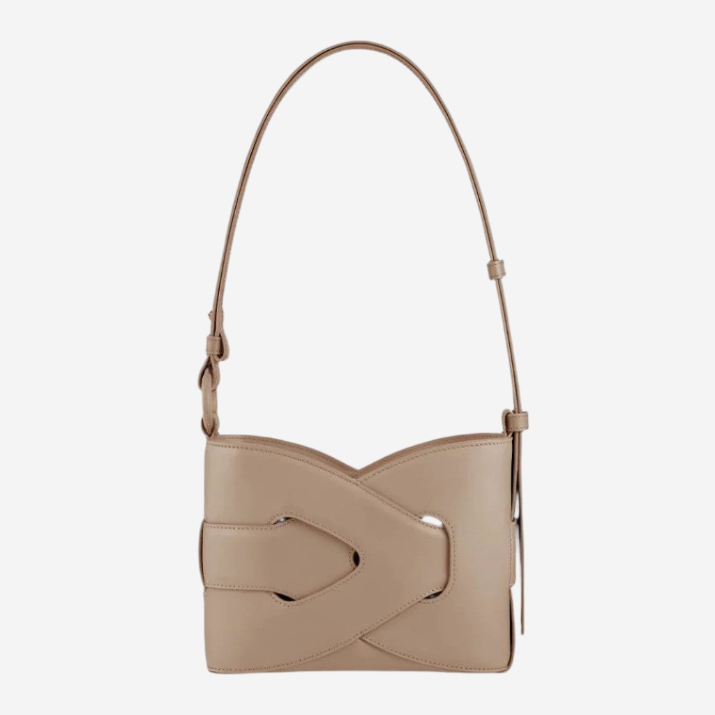 A tan leather handbag with a curved handle and a distinctive cutout in the front.