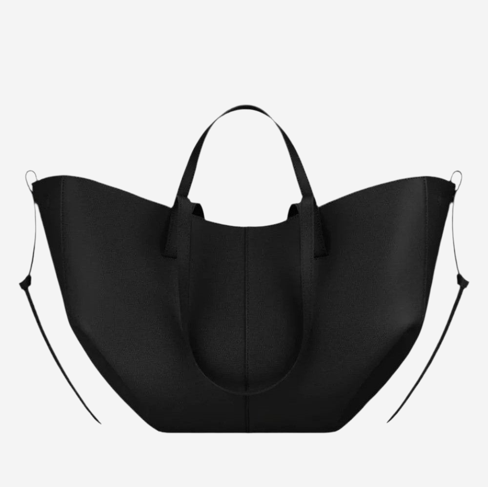 A large black tote bag with a curved handle and two straps.