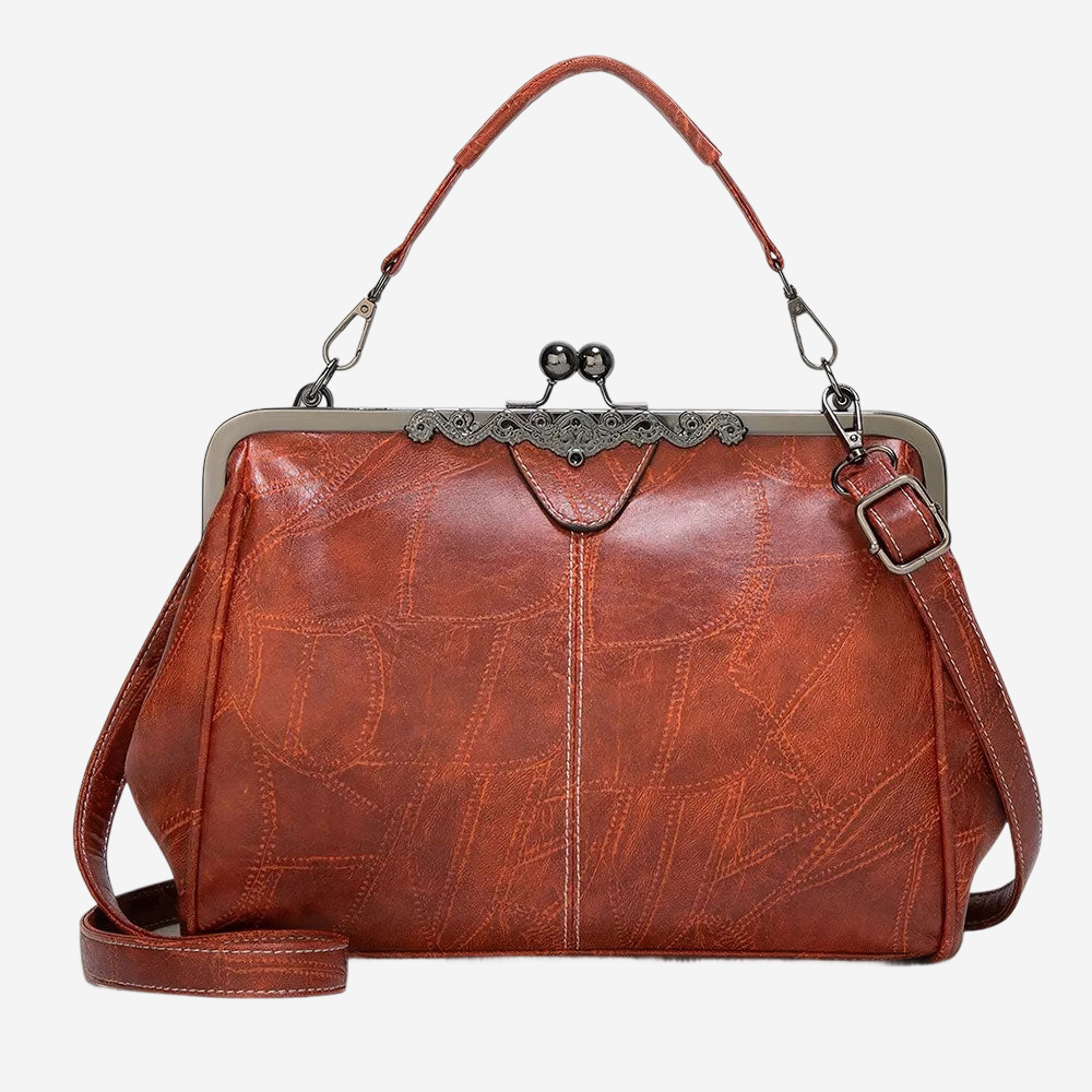A brown leather handbag with a metal clasp and strap.