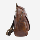 A brown leather backpack with a zipper closure and a front pocket.