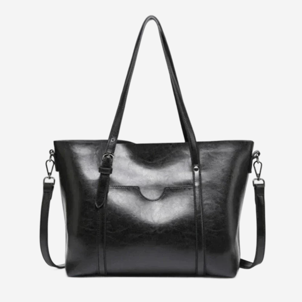 A black leather tote bag with a curved handle and two shoulder straps.