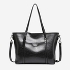 A black leather tote bag with a curved handle and two shoulder straps.