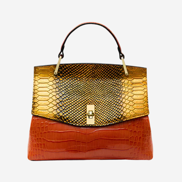 A stylish handbag with a combination of red and gold colors, featuring a textured pattern and a metallic clasp.