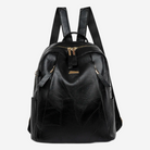 A black leather backpack with multiple zippers and straps.