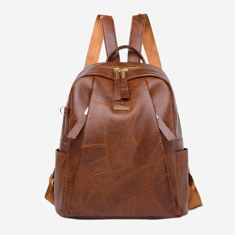A brown leather backpack with a distinctive patchwork design.
